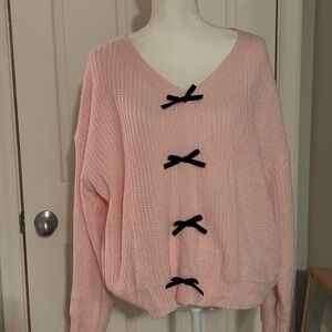 Cupshie Pink V-Neck Sweater with Black Bow Accents